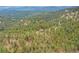 Secluded mountain home surrounded by lush forestry and rolling hills in a serene location at 2013 Swede Gulch Rd, Evergreen, CO 80439