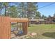 Property includes backyard chicken coop with lots of trees surrounding the house and yard at 2013 Swede Gulch Rd, Evergreen, CO 80439