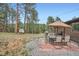 Outdoor dining and seating area, featuring a grill and lush greenery for entertaining and relaxation at 2013 Swede Gulch Rd, Evergreen, CO 80439