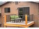 Cozy balcony featuring a cushioned seating area, perfect for outdoor relaxation and enjoying scenic views at 2013 Swede Gulch Rd, Evergreen, CO 80439