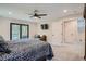 Bedroom featuring ceiling fan, balcony access, and en-suite bathroom at 2013 Swede Gulch Rd, Evergreen, CO 80439