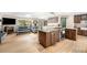 Open kitchen featuring wood cabinets, granite counters, stainless steel appliances, and wood flooring at 2013 Swede Gulch Rd, Evergreen, CO 80439