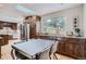 Eat-in kitchen with stainless steel appliances, dark wood cabinetry, and views of backyard at 2013 Swede Gulch Rd, Evergreen, CO 80439