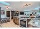 Spacious kitchen with granite countertops, wood cabinets, and stainless steel appliances at 2013 Swede Gulch Rd, Evergreen, CO 80439
