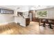 Open kitchen featuring stainless steel appliances, granite countertops, a breakfast bar and hardwood floors at 2013 Swede Gulch Rd, Evergreen, CO 80439