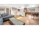 Spacious living space with hardwood floors, bar seating, and natural light from skylights and windows at 2013 Swede Gulch Rd, Evergreen, CO 80439
