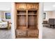 Well-organized mud room featuring built-in shelving, hooks, and drawers for optimal storage and convenience at 2013 Swede Gulch Rd, Evergreen, CO 80439