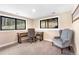 Bright office space with two windows, neutral carpet and paint, and a desk and chair at 2013 Swede Gulch Rd, Evergreen, CO 80439
