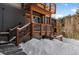 Exterior of home with snowy stairs and deck at 147 Illinois Gulch Rd # 4, Breckenridge, CO 80424