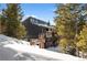 Home's exterior with snowy yard and signage at 147 Illinois Gulch Rd # 4, Breckenridge, CO 80424