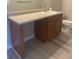 A bathroom vanity with a sink, light countertop, and wooden cabinets at 9768 Mayfair St # E, Englewood, CO 80112