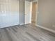 The bedroom offers a closet and light gray vinyl flooring throughout the space at 9768 Mayfair St # E, Englewood, CO 80112