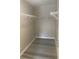 An empty walk-in closet with white wire shelves at 9768 Mayfair St # E, Englewood, CO 80112