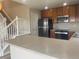 Beautiful kitchen featuring stainless steel appliances, granite countertops, wood cabinets, and luxury vinyl plank flooring at 9768 Mayfair St # E, Englewood, CO 80112