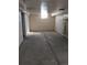 Unfinished basement with concrete floor, block walls, and limited natural light at 698 S 2Nd Ave, Brighton, CO 80601