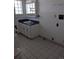 Bathroom featuring tile flooring, a vanity with a dark countertop, and a block window at 698 S 2Nd Ave, Brighton, CO 80601