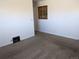 A simple bedroom featuring neutral walls, plush carpet, and a small window, creating a cozy space at 698 S 2Nd Ave, Brighton, CO 80601