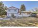 Large backyard with a patio and plenty of space for outdoor activities at 1490 S Iris St, Lakewood, CO 80232