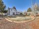 Landscaped backyard offering a large grassy area and a patio at 1490 S Iris St, Lakewood, CO 80232