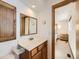 Bathroom with single sink vanity, and a view into a bedroom at 1490 S Iris St, Lakewood, CO 80232