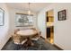 Dining area with round table and chairs, near the kitchen at 1490 S Iris St, Lakewood, CO 80232