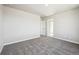 Spacious bedroom with neutral walls and gray carpeting at 2283 Serenidad St, Brighton, CO 80601