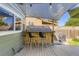 Backyard patio with a built-in bar, complete with seating and shade for outdoor enjoyment at 5327 Suffolk Cir, Castle Rock, CO 80104