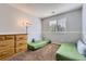 Neutral bedroom with two floor mattresses, dresser, and window at 5327 Suffolk Cir, Castle Rock, CO 80104