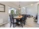 Open dining area features a view of the living room with vaulted ceilings and access to the outdoor deck at 5327 Suffolk Cir, Castle Rock, CO 80104