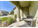 Cozy front porch featuring a bistro table and chairs, perfect for enjoying the outdoors at 5327 Suffolk Cir, Castle Rock, CO 80104