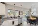 Bright kitchen with granite countertops, stainless steel appliances, and sliding door access to the outdoor deck at 5327 Suffolk Cir, Castle Rock, CO 80104