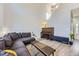 Open living area featuring a piano and sofa, with abundant natural light and stylish decor at 5327 Suffolk Cir, Castle Rock, CO 80104