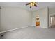 Bedroom with high ceilings, a ceiling fan, and a view to the bathroom at 8258 S Sicily Ct, Aurora, CO 80016