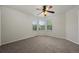 Bright bedroom featuring bay window and neutral carpeting at 8258 S Sicily Ct, Aurora, CO 80016