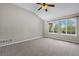 Spacious bedroom with vaulted ceilings, ceiling fan, and large window at 8258 S Sicily Ct, Aurora, CO 80016