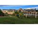 Clubhouse exterior showcases architecture, a pool, and landscaping at 8258 S Sicily Ct, Aurora, CO 80016