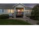 Inviting house facade includes a front porch and well-maintained lawn at 8258 S Sicily Ct, Aurora, CO 80016