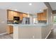 Eat-in kitchen features a breakfast bar, modern appliances, and ample counter space at 8258 S Sicily Ct, Aurora, CO 80016