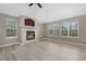 Bright, airy living room features a cozy fireplace, vaulted ceiling and windows for natural light at 8258 S Sicily Ct, Aurora, CO 80016