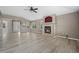 Open-concept living room featuring luxury vinyl flooring, fireplace and natural light at 8258 S Sicily Ct, Aurora, CO 80016