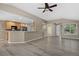 Inviting living room with updated floors, open to the kitchen and breakfast bar, great for entertaining at 8258 S Sicily Ct, Aurora, CO 80016