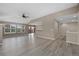 Spacious living room with ceiling fan open to dining area at 8258 S Sicily Ct, Aurora, CO 80016