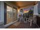 Covered patio with seating offers a relaxing outdoor space with views of the interior and sunset at 8258 S Sicily Ct, Aurora, CO 80016