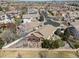 Aerial view showcasing a home's backyard with a pergola, patio, and landscaping in a suburban neighborhood at 418 Rifle Ct, Broomfield, CO 80020