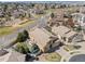 Aerial view of a home showcasing its tile roof, landscaped yard, patio with pergola and neighborhood at 418 Rifle Ct, Broomfield, CO 80020