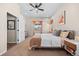 Bedroom with ceiling fan, neutral carpet, and natural light at 418 Rifle Ct, Broomfield, CO 80020