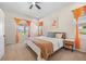 Comfortable bedroom with a ceiling fan and large windows at 418 Rifle Ct, Broomfield, CO 80020