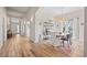 Elegant dining room with hardwood floors, large windows, decorative lighting, and stylish furnishings at 418 Rifle Ct, Broomfield, CO 80020