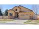 Charming single-Gathering home featuring a two-car garage, stone accents, neutral stucco, and professional landscaping at 418 Rifle Ct, Broomfield, CO 80020