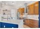 Modern kitchen featuring quartz countertops, stainless steel appliances, and wooden cabinetry at 418 Rifle Ct, Broomfield, CO 80020
